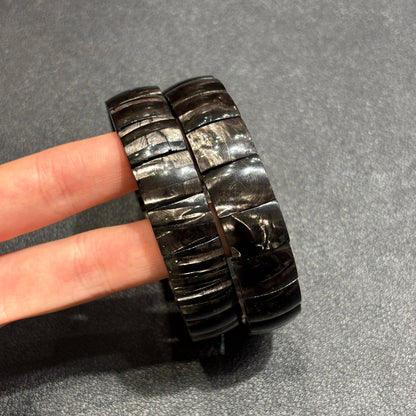 Overhead view of natural hypersthene tablet bead bracelet; clean lines, consistent width, elastic cord hidden for seamless look