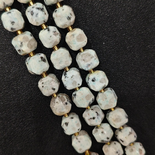 Close up of multi strands of natural kiwi jasper soft-tumbled geometric cube beads showing overall strand layout