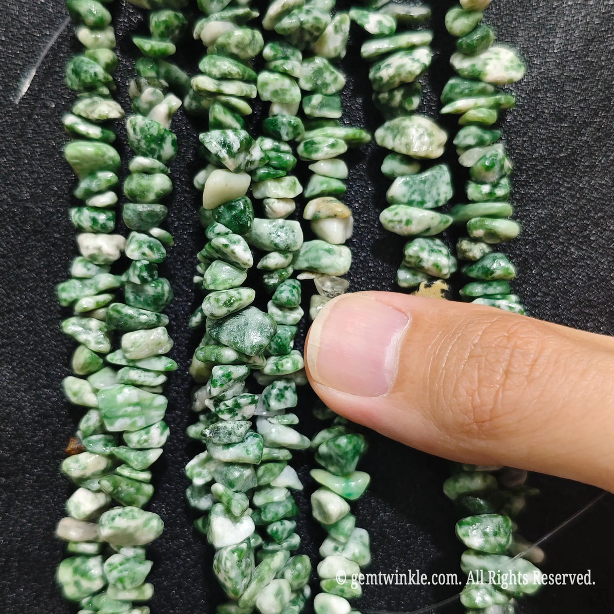 Detailed view of 75cm long natural kiwi jasper tumbled chipped gemstone strand for jewelry DIY