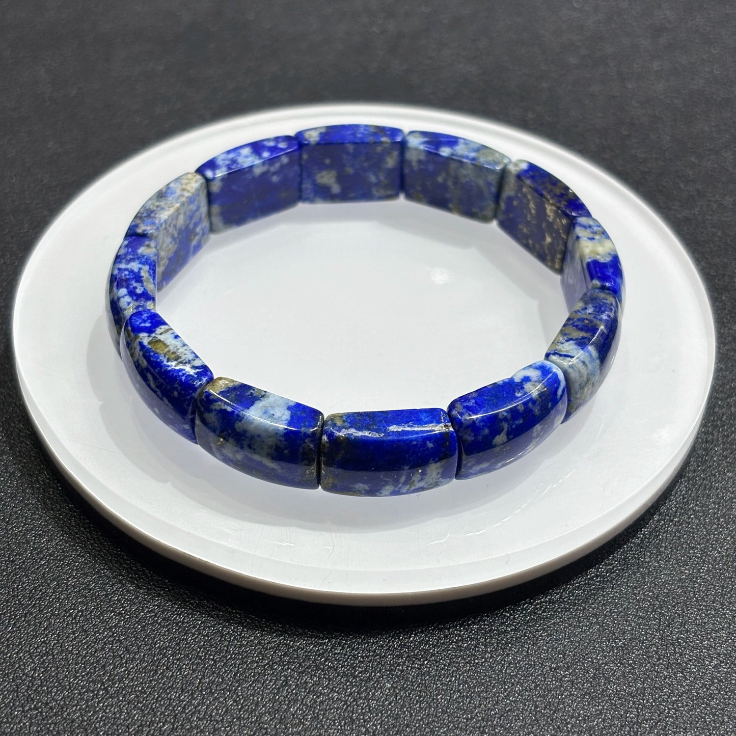 Overhead view: natural lapis lazuli square tablet beads in full circle; elastic cord hidden, ideal for daily fashion wear