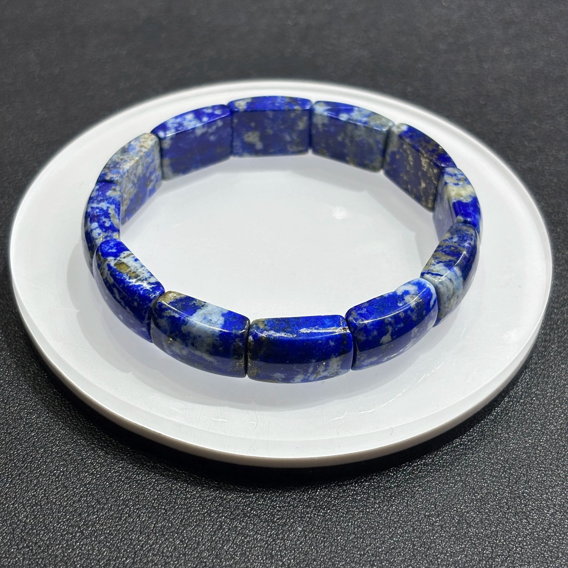 Overhead view: natural lapis lazuli square tablet beads in full circle; elastic cord hidden, ideal for daily fashion wear