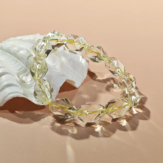 Faceted citrine beads in vibrant lemon yellow tones, high transparency with minimal internal inclusions—stretch elastic design