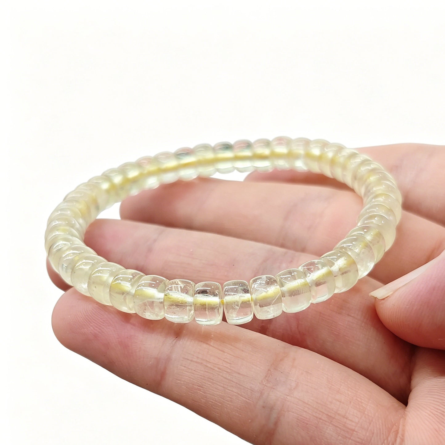 Lemon citrine tablet bracelet resting on palm—highlighting delicate size, vibrant yellow hue, and natural clarity