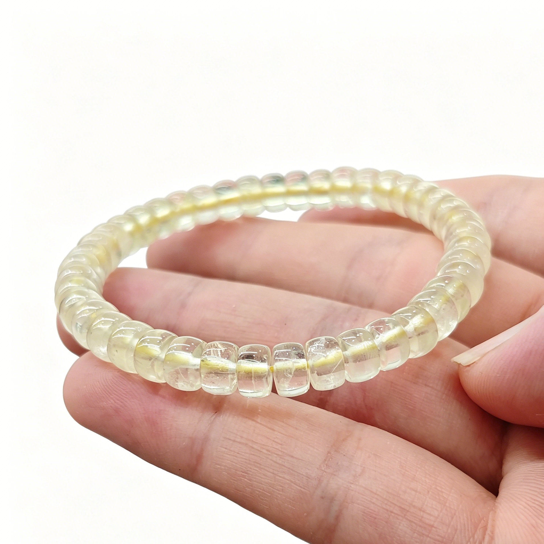 Lemon citrine tablet bracelet resting on palm—highlighting delicate size, vibrant yellow hue, and natural clarity
