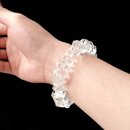 Men’s natural crystal bracelet worn on wrist: chunky 16–20mm beads, flexible fit, minimalist spiritual accessory for daily wear or meditation sessions