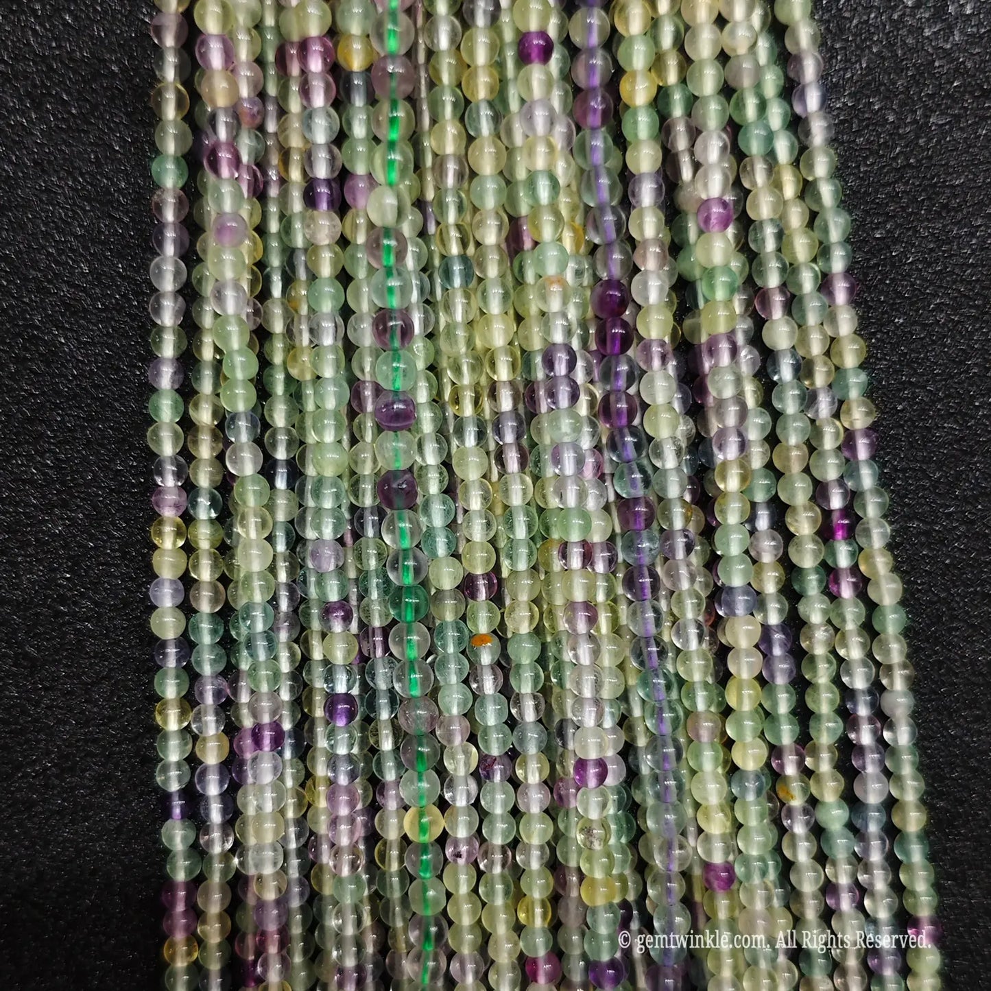 Fine 3mm round crystal beads wholesale showing translucent character and inner cloudiness