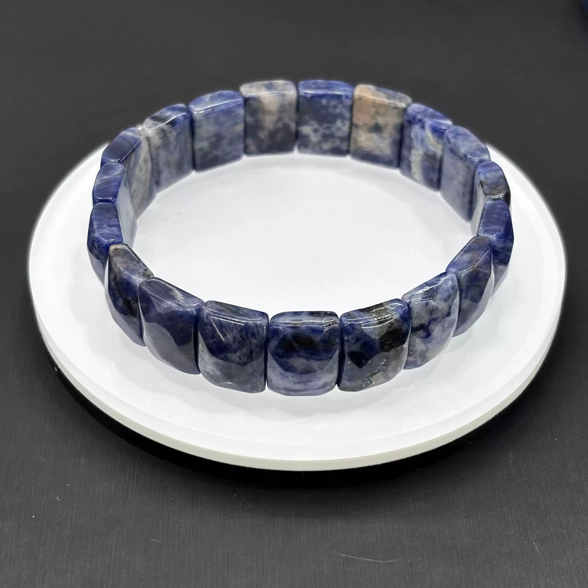Clean presentation: natural sodalite rectangular beads strung on elastic cord—no metal, no clasp