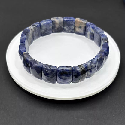 Clean presentation: natural sodalite rectangular beads strung on elastic cord—no metal, no clasp