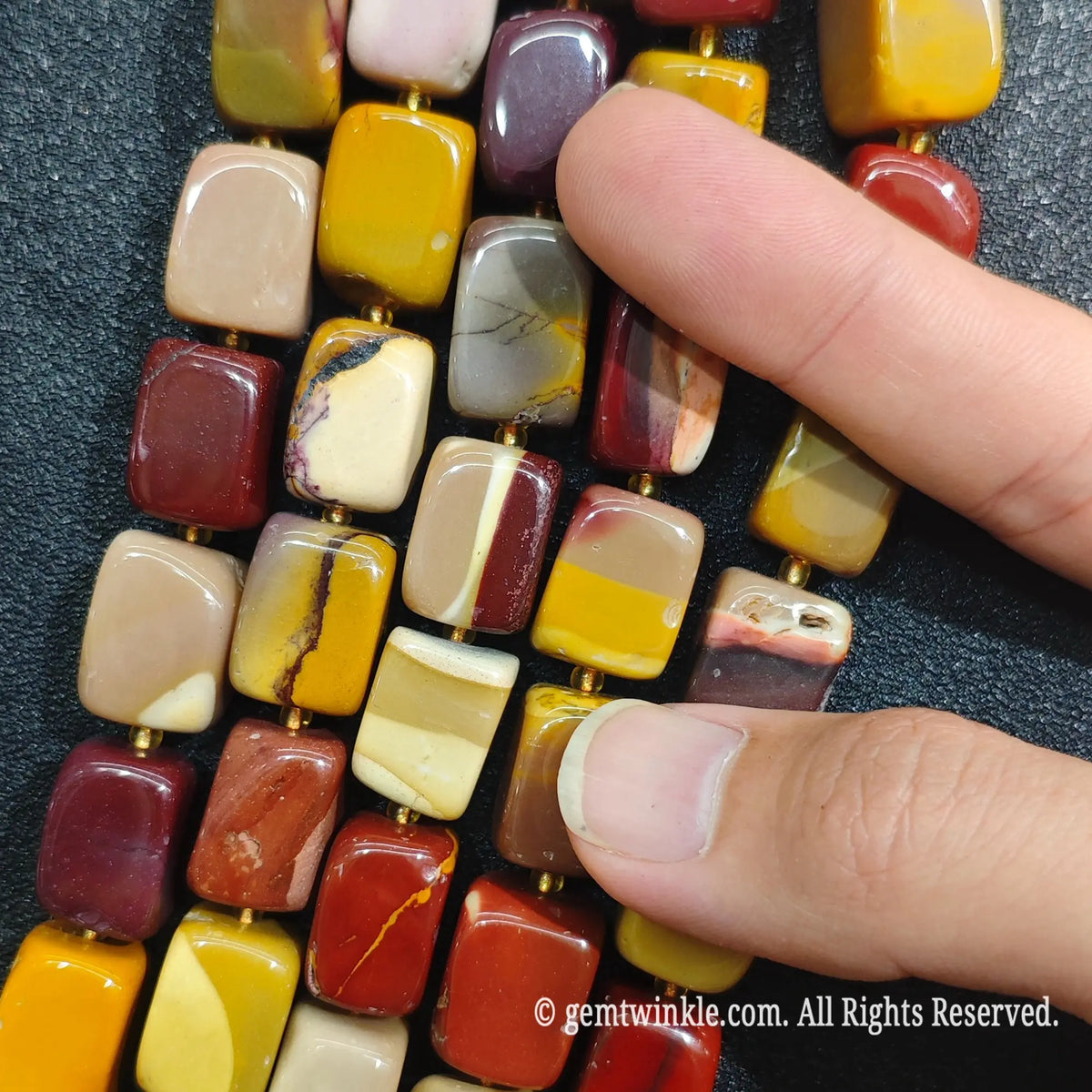 Close up view of center drilled Mookaite Jasper square spacer beads ideal for artisan jewelry making