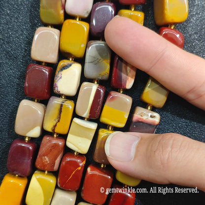 Close up view of center drilled Mookaite Jasper square spacer beads ideal for artisan jewelry making