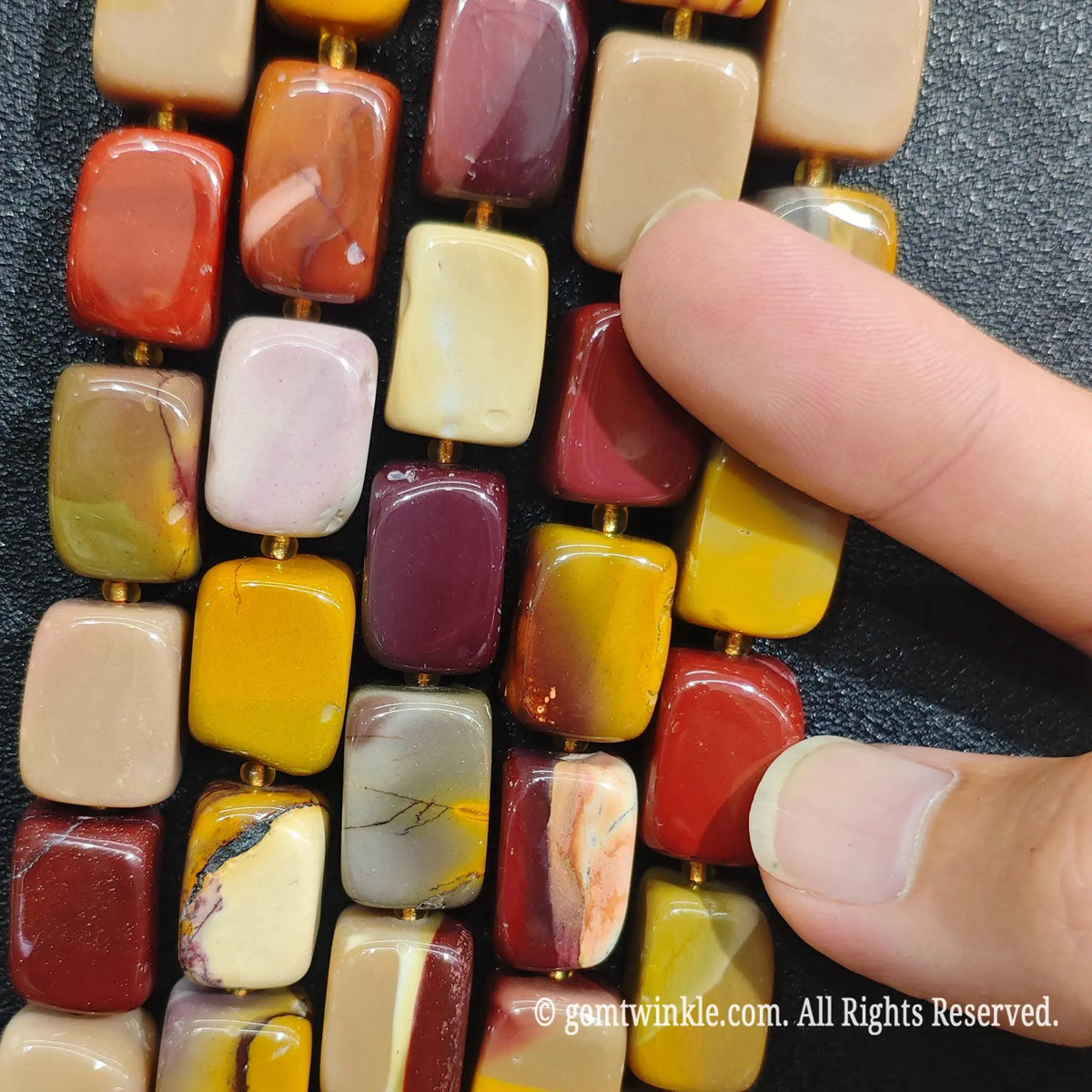 Detailed shot of natural Mookaite Jasper square beads perfect for Etsy crafters and DIY jewelry supply orders