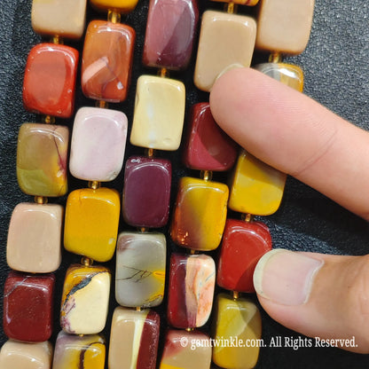 Detailed shot of natural Mookaite Jasper square beads perfect for Etsy crafters and DIY jewelry supply orders