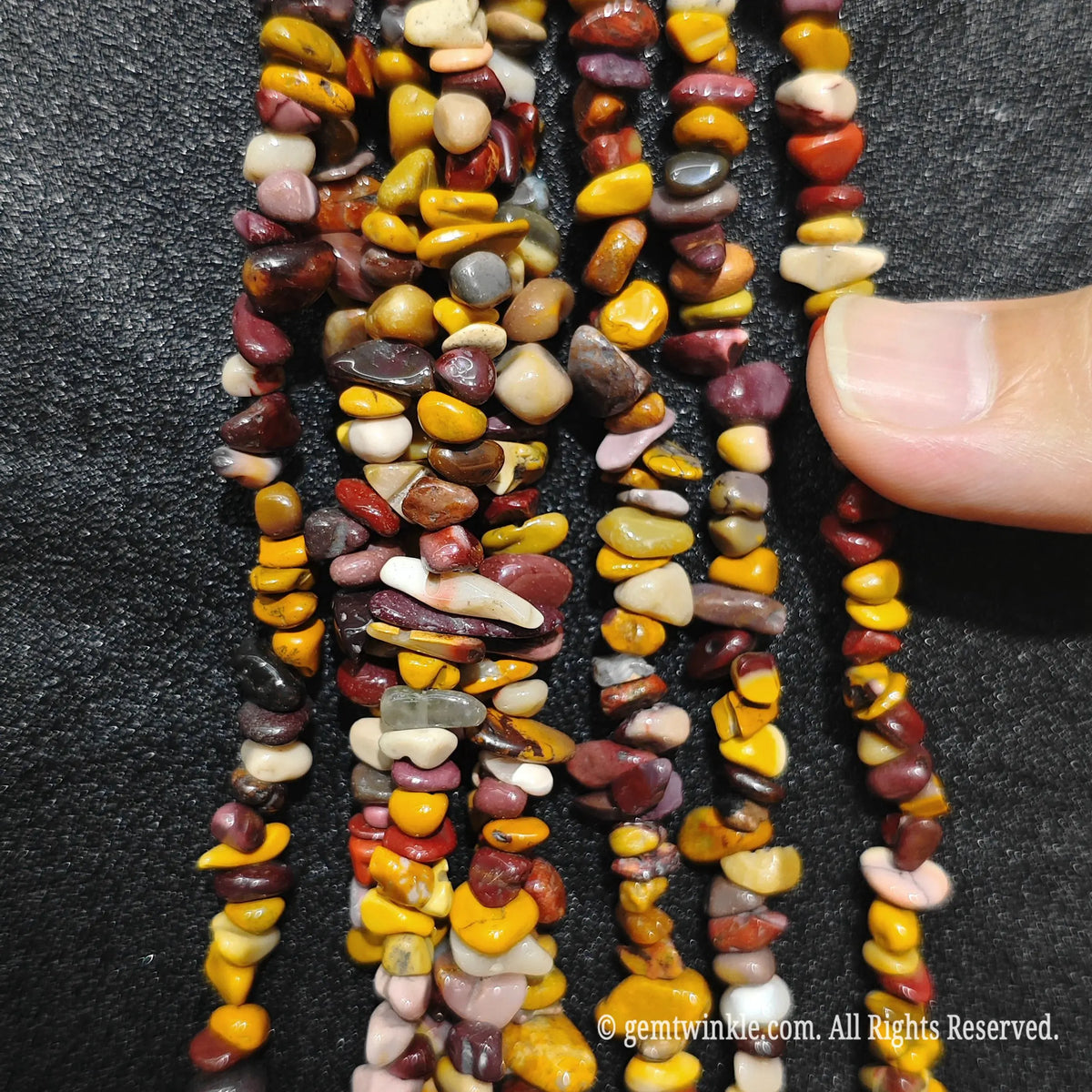 Detailed view of long 75cm natural mookite chipped strand ready for DIY jewelry projects