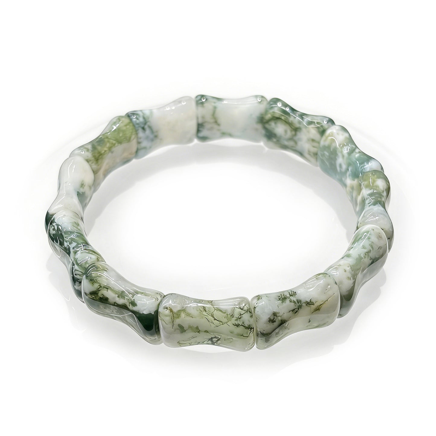  Close up of the natural moss agate bamboo bead texture and green inclusions.