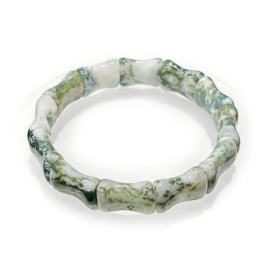 Close up of the natural moss agate bamboo bead texture and green inclusions.