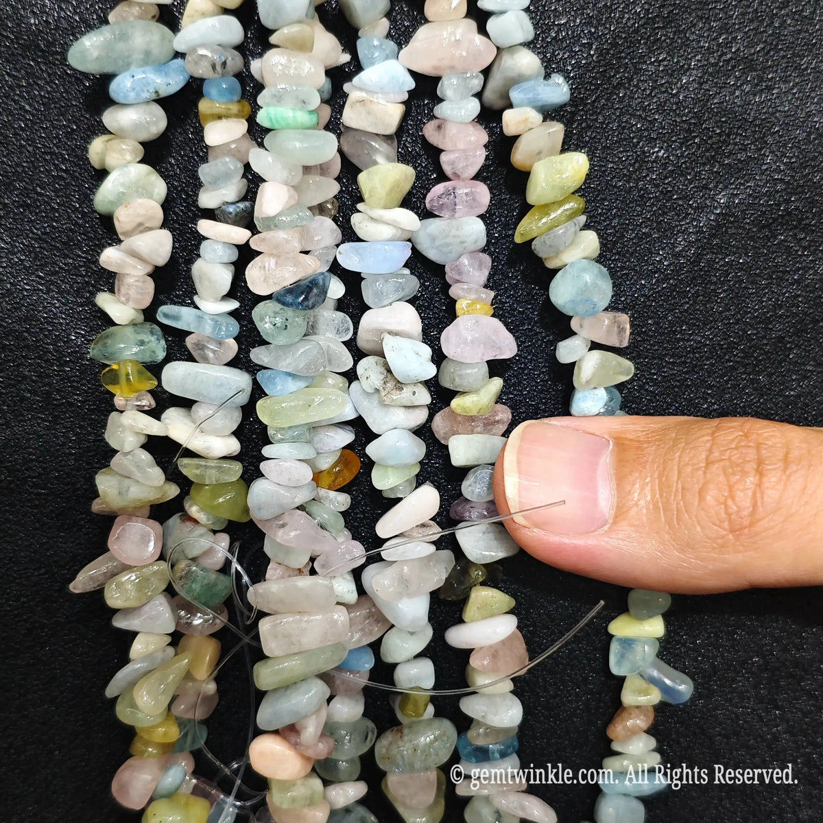 Detailed view of 75cm long natural multi-color morganite tumbled chipped gemstone strand for jewelry DIY