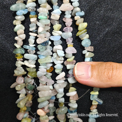 Detailed view of 75cm long natural multi-color morganite tumbled chipped gemstone strand for jewelry DIY