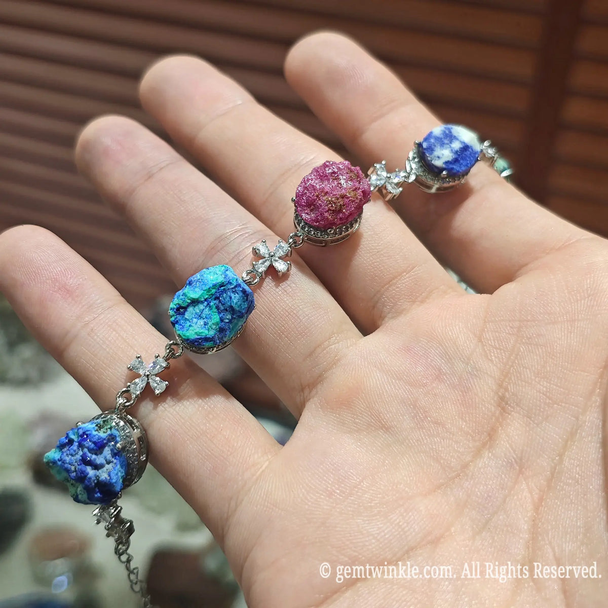 Close up view of natural azurite cobalt calcite and quartz druzy slices linked on adjustable metallic chain
