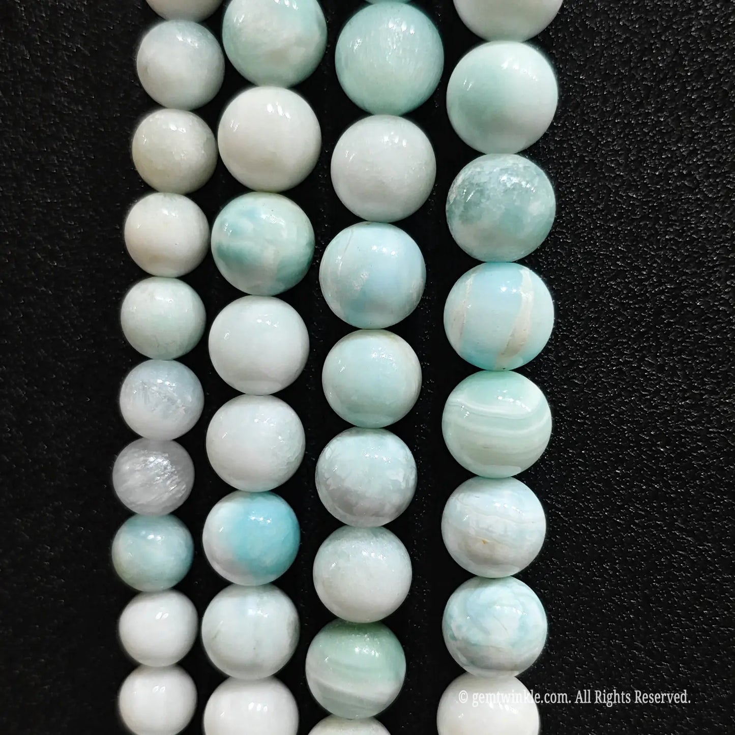 Loose hemimorphite gemstone beads with white and blue veining patterns