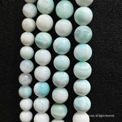 Loose hemimorphite gemstone beads with white and blue veining patterns
