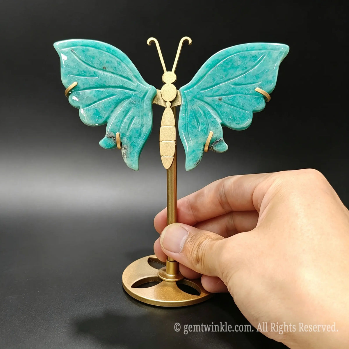 Carved natural amazonite butterfly stone figurine showcasing blue-green turquoise tones
