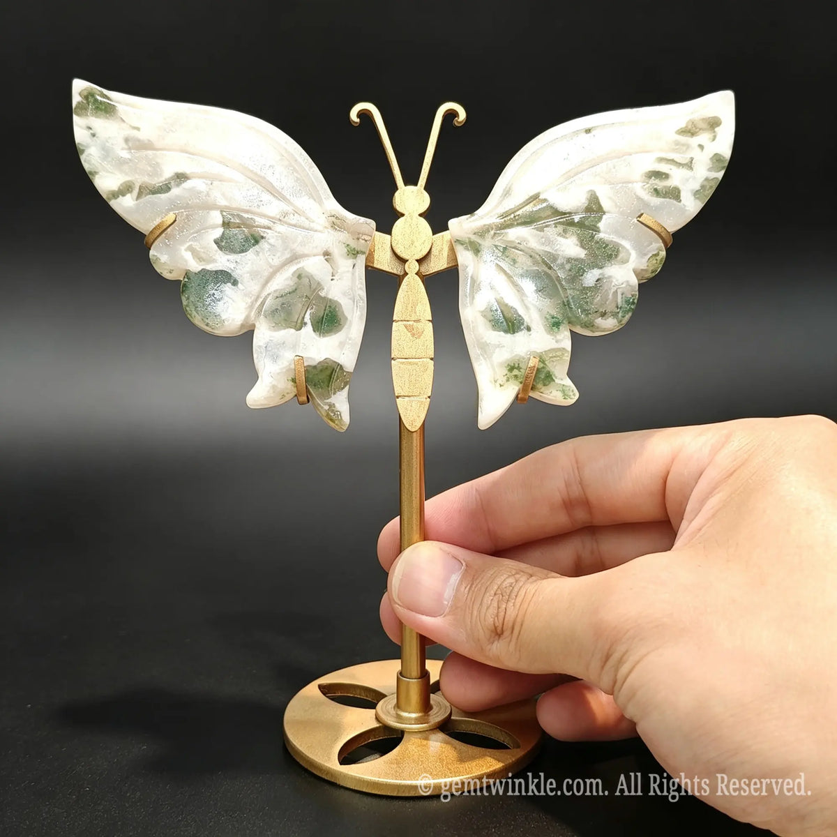 Carved natural dendritic agate butterfly gemstone figurine showing moss-like inclusions