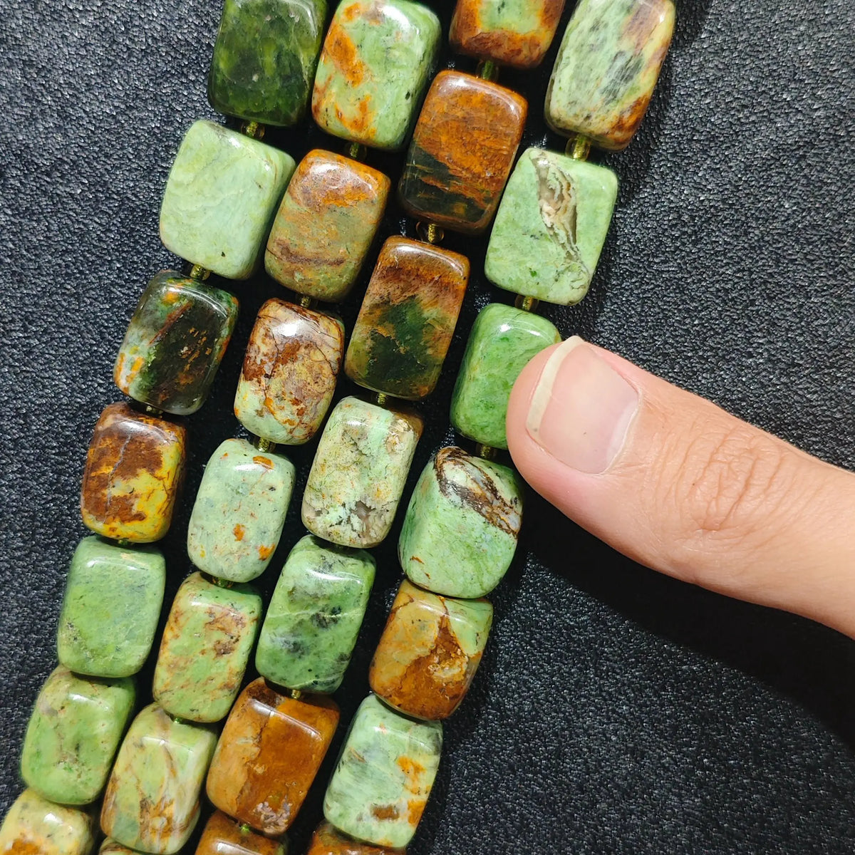 Multiple strands of chunky natural green jasper rectangular pillar beads showing mossy green and brown matrix