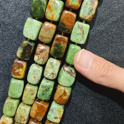 Multiple strands of chunky natural green jasper rectangular pillar beads showing mossy green and brown matrix