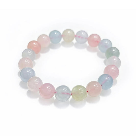 Natural morganite stretch bracelet with 10mm smooth round beads arranged in circle on pure white background, no metal.