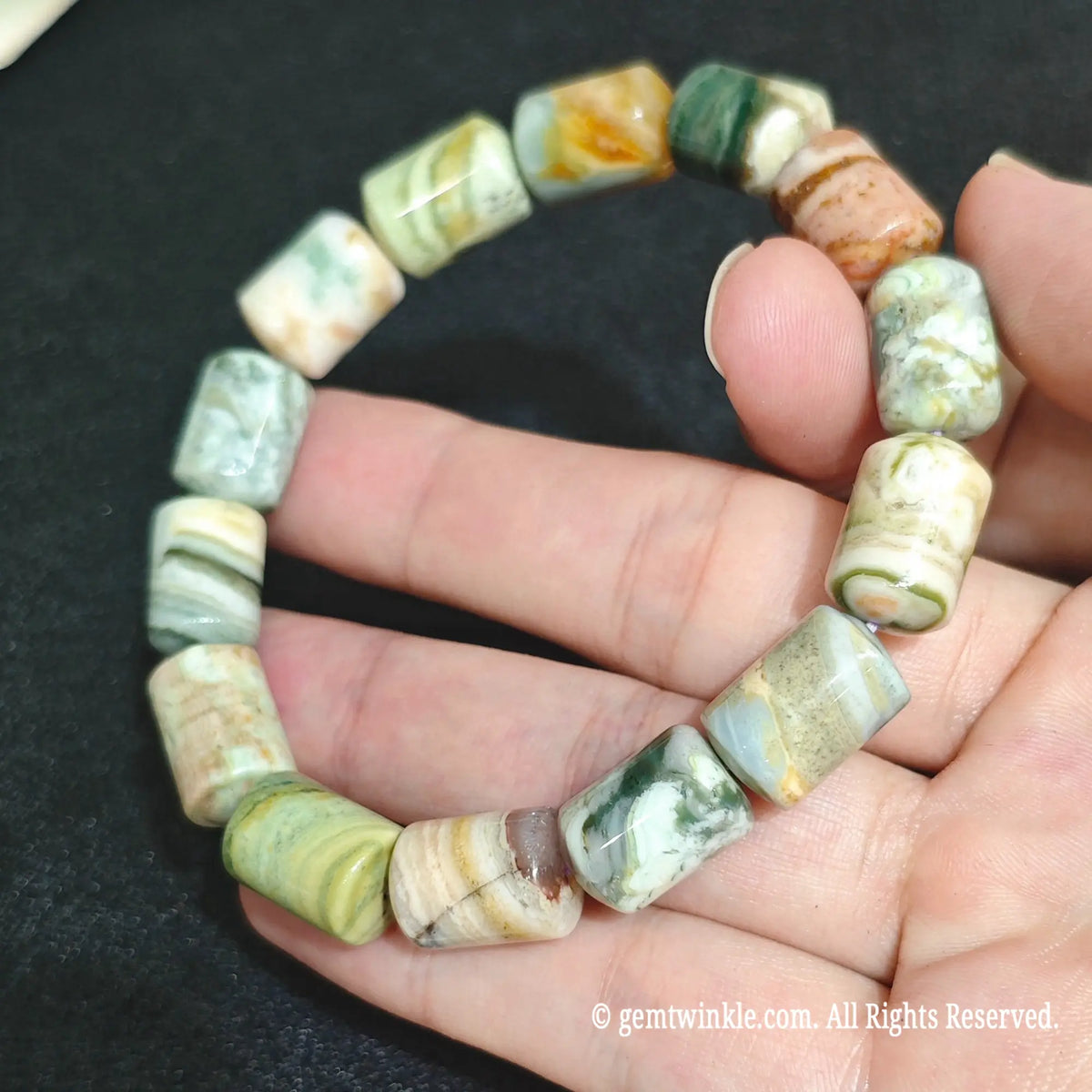 Ocean Jasper Barrel Bead Strands Close Up on Hand
