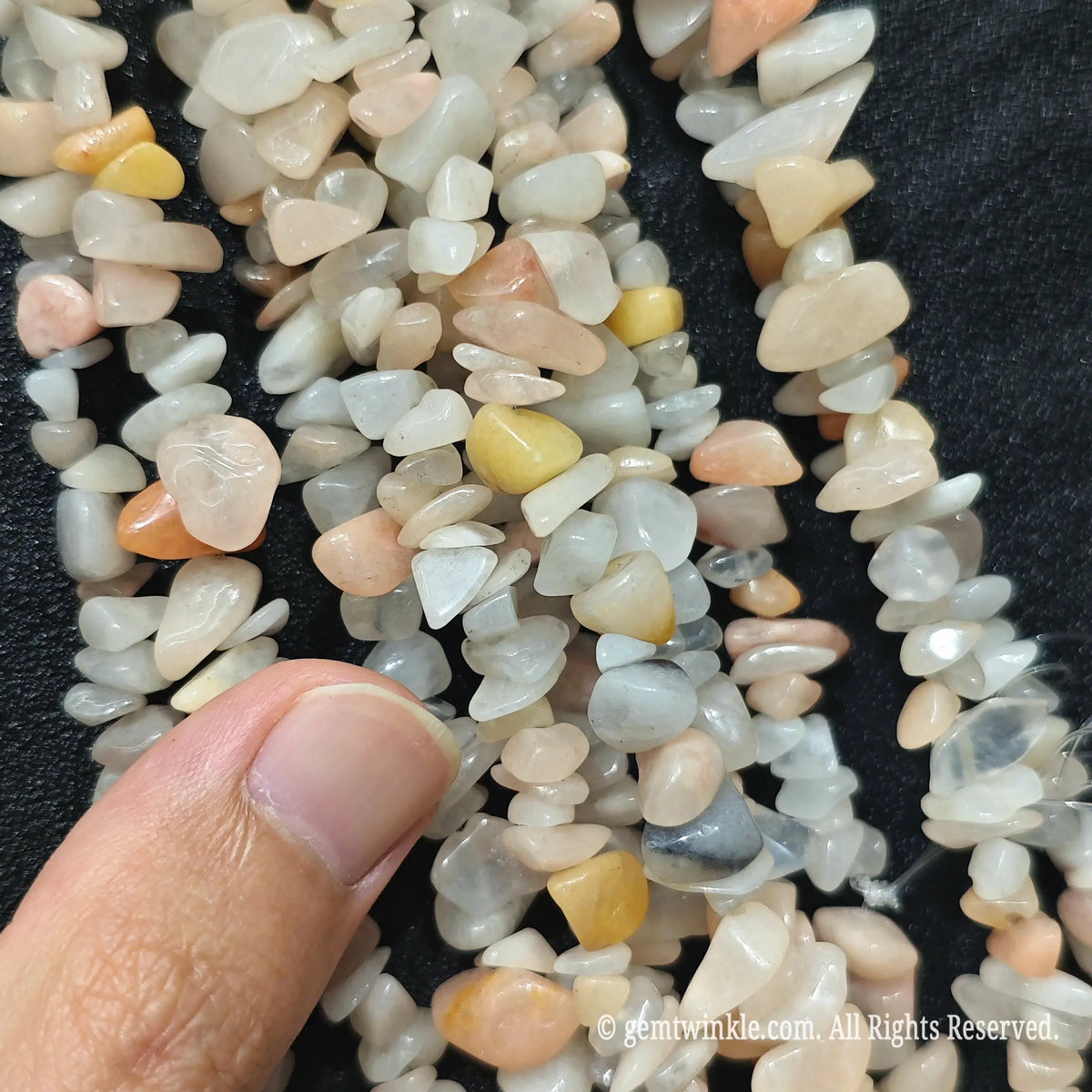 Detailed view of long 75cm natural pink aventurine chipped strand ready for jewelry making