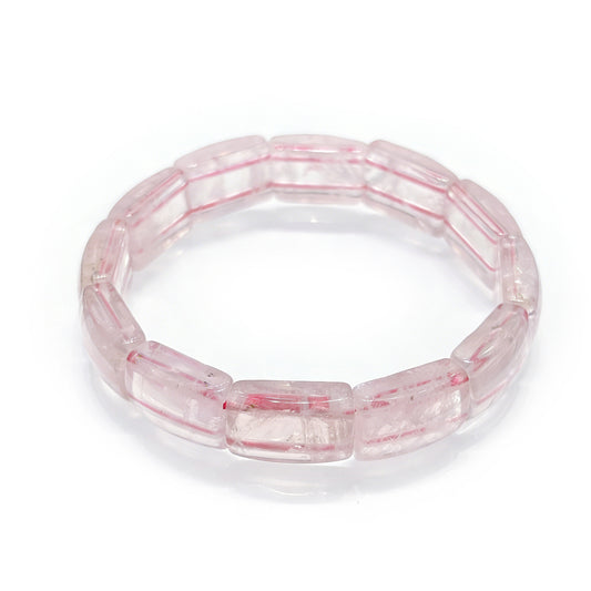 Natural rose quartz cylindrical bead bracelet with soft pink translucency and delicate internal inclusions; 17cm stretch for gentle presence