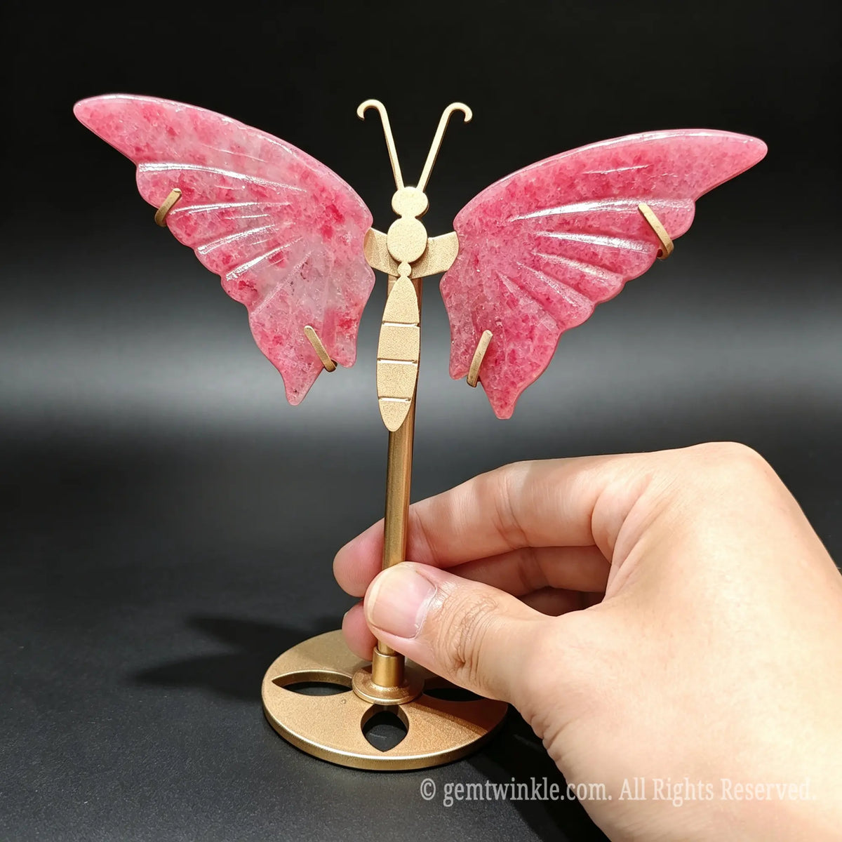 Carved natural sakura rain stone butterfly figurine featuring delicate floating petal patterns