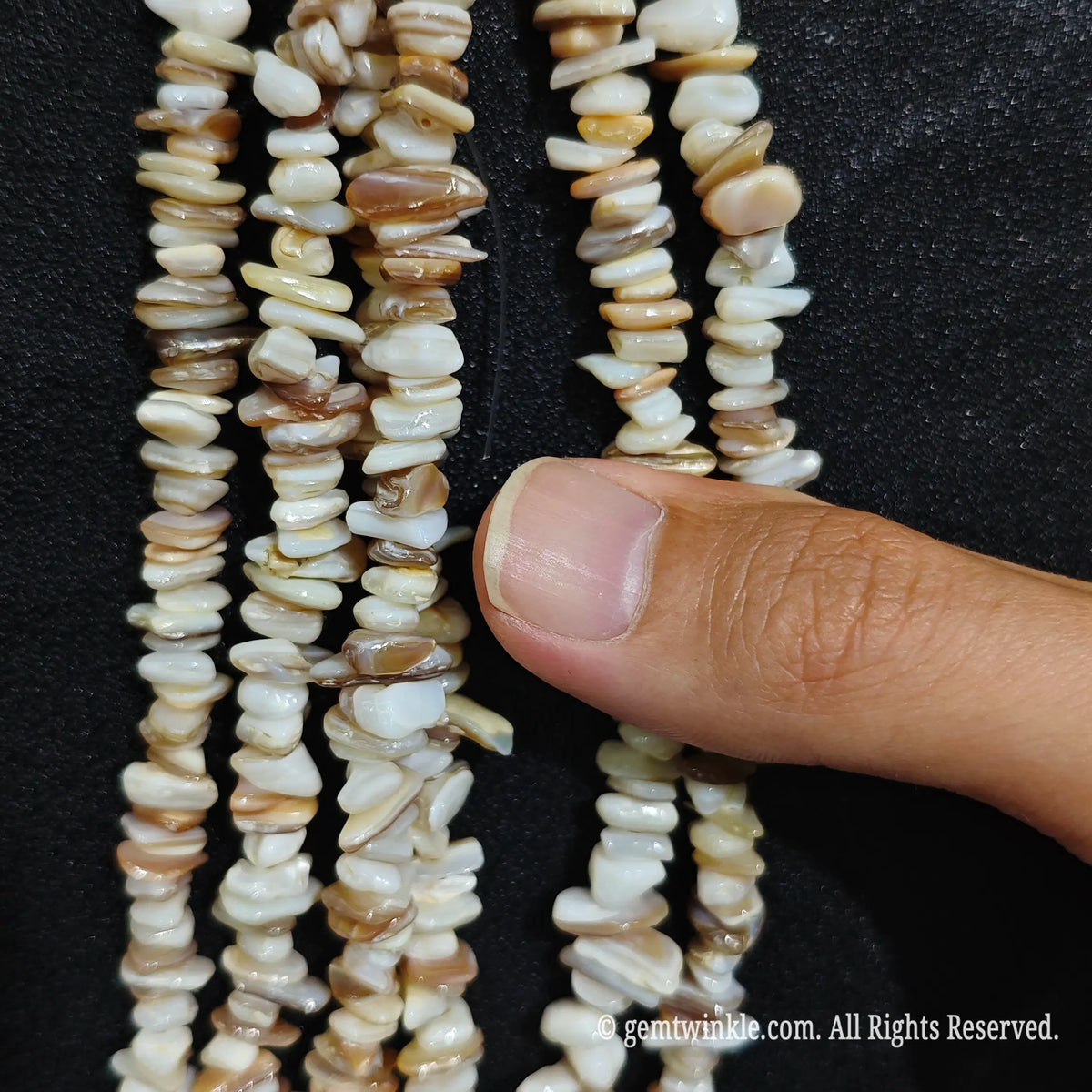 Detailed view of 75cm long natural shell tumbled chipped gemstone strand for jewelry DIY[cite: 8]