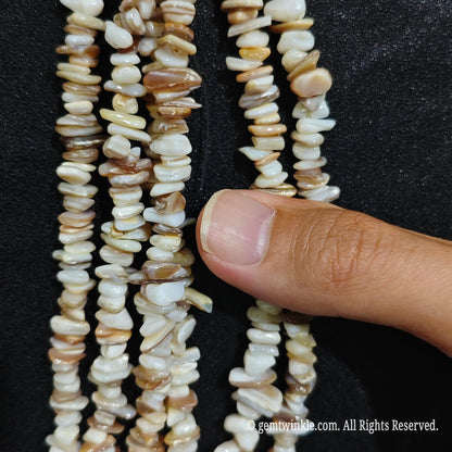 Detailed view of 75cm long natural shell tumbled chipped gemstone strand for jewelry DIY[cite: 8]
