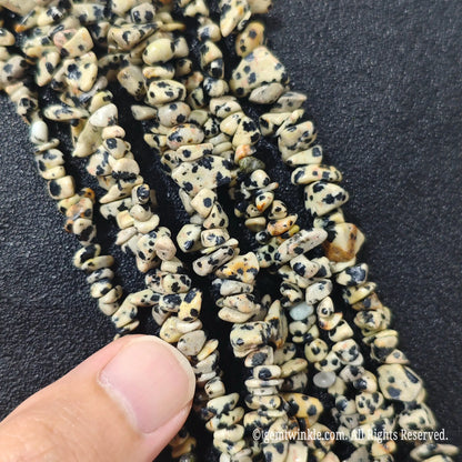 Detailed view of long 75cm natural darmatian jasper chipped strand ready for jewelry making[cite: 8]