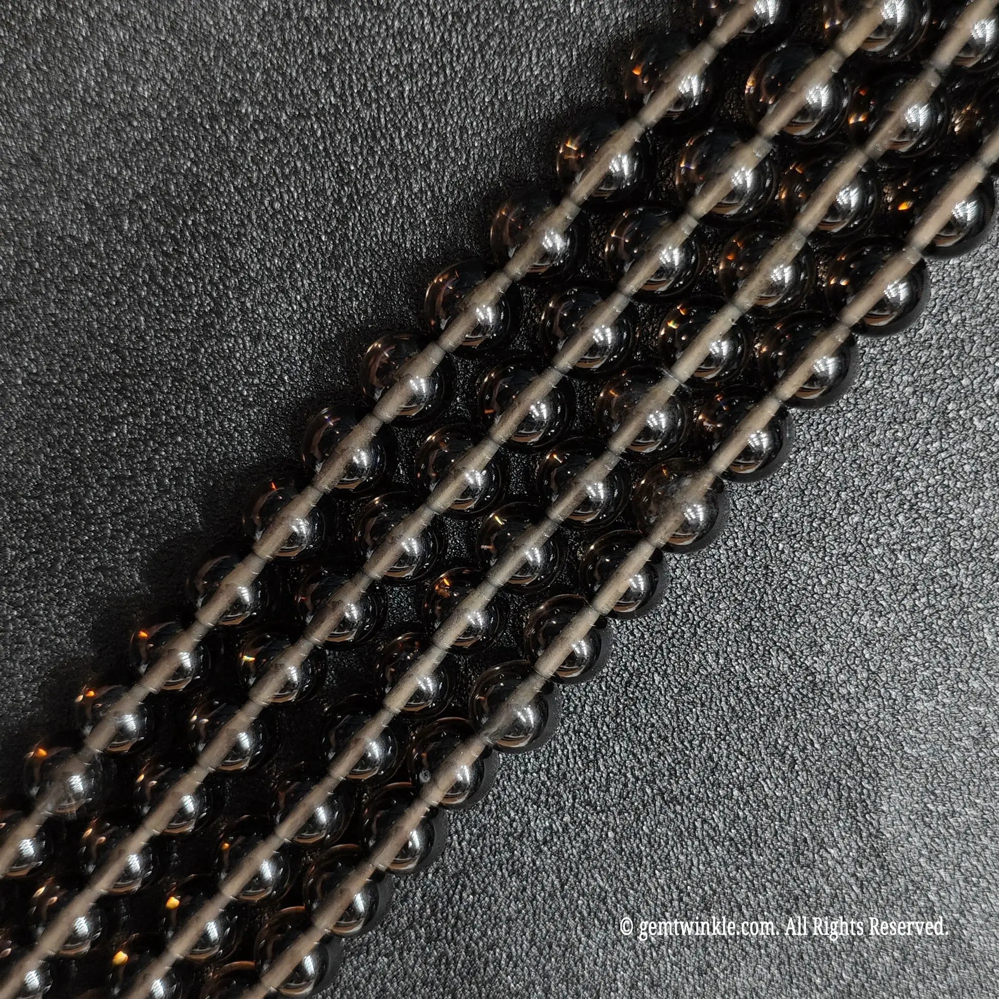 Natural ice obsidian crystal beads strands showing beautiful translucent smoky tea color under light