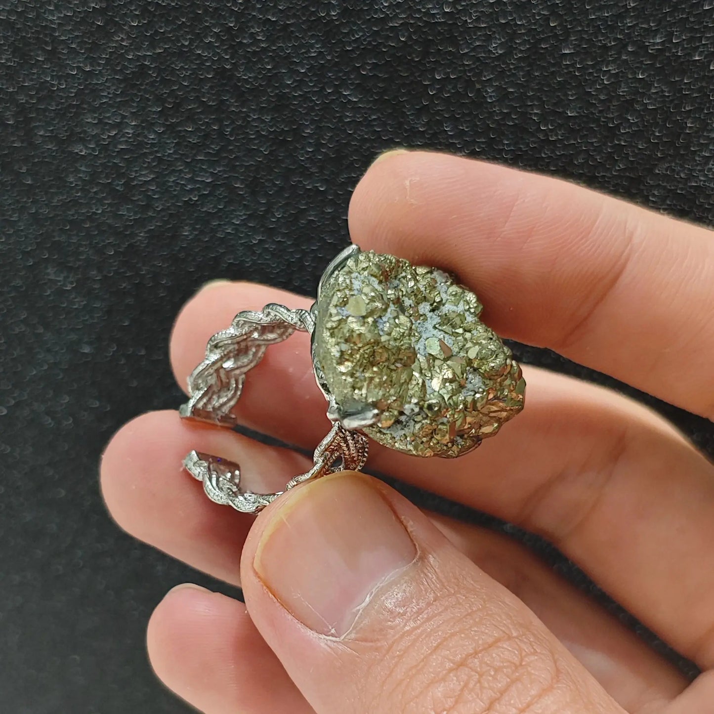 Shimmering raw pyrite cluster ring showcasing the textured adjustable alloy ring band and stone underside