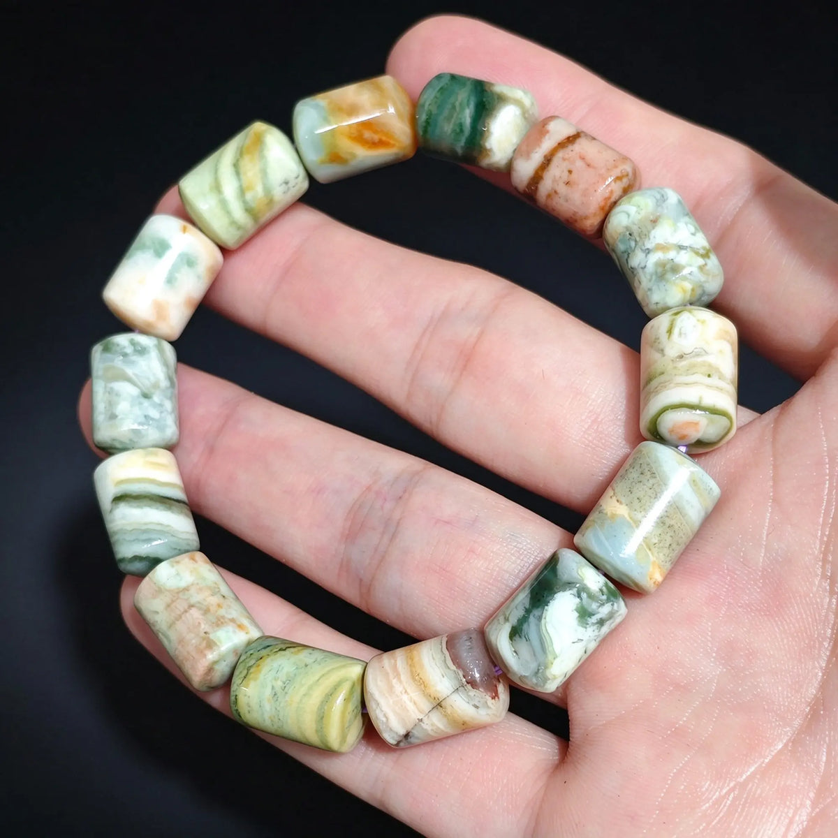 Ocean jasper is a microcrystalline quartz with good durability, making it suitable for regular wear. To maintain its natural luster, clean gently with warm soapy water and a soft cloth. Avoid exposure to harsh chemical solvents, acidic solutions, or prolonged direct sunlight. When not worn, store your gemstone jewelry in a separate cloth pouch to prevent friction with harder minerals.
