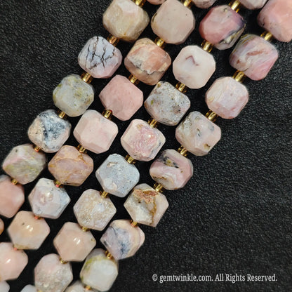 Multiple parallel strands of natural pink opal soft-tumbled cube beads viewed from distance[cite: 6]