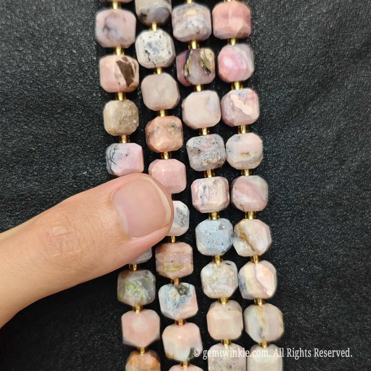 Detailed macro view of natural pink opal geometric cube beads showcasing soft pastel pink tones and natural matrix[cite: 6]