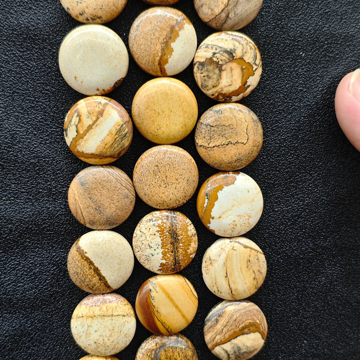 Strands of natural picture jasper smooth flat round coin beads displaying desert landscape patterns for DIY jewelry making