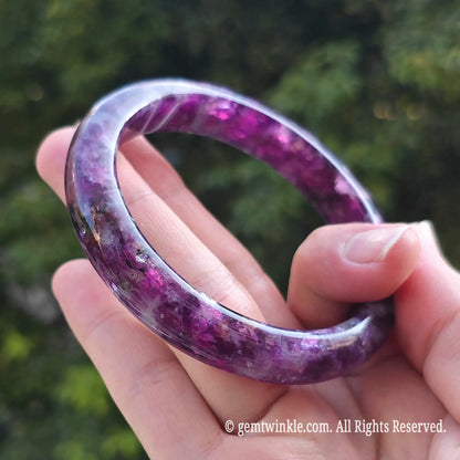 Detailed shot of natural purple lepidolite gemstone bangle perfect for retail stores and spiritual wellness gifts