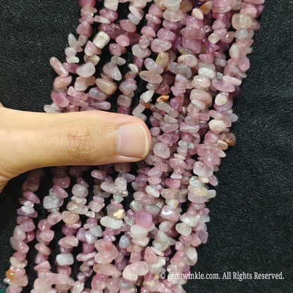 Detailed view of long 75cm natural purple pink quartz chipped strand ready for DIY projects