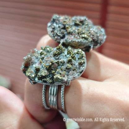 Side profile view of a natural raw pyrite cluster statement ring showing the adjustable open alloy band