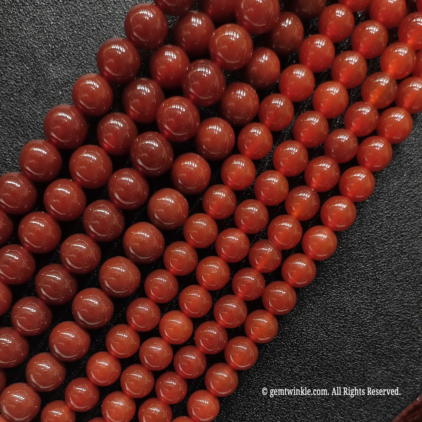Heat treated Red Agate beads close up texture