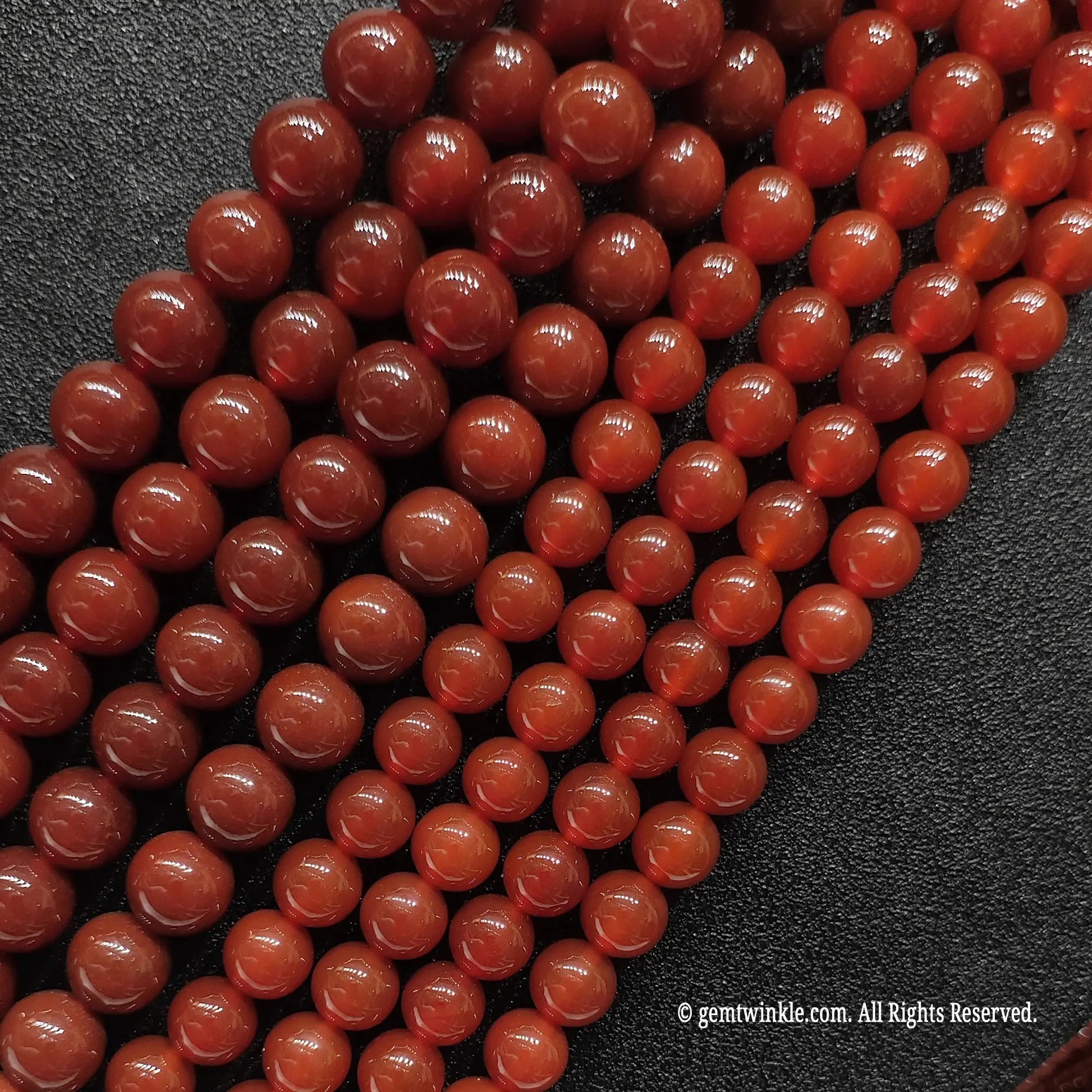 Heat treated Red Agate beads close up texture