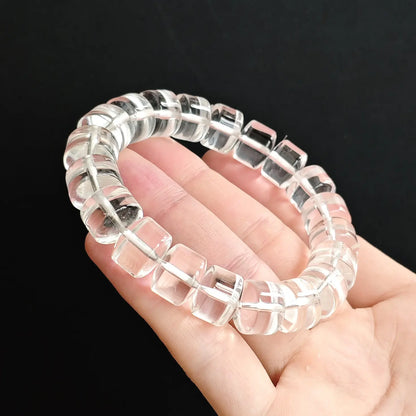 Unisex clear quartz rondelle bead handchain held flat—showing consistent thickness, clean symmetry, and transparent purity