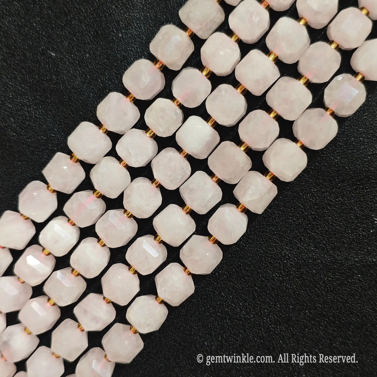 Vertical layout of natural rose quartz 10mm soft square gemstone block beads to show proportion and crystalline texture