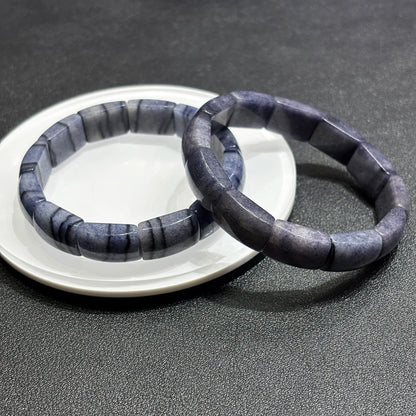 wo blue aventurine square tablet bracelets layered on white dish, highlighting natural mica inclusions and texture
